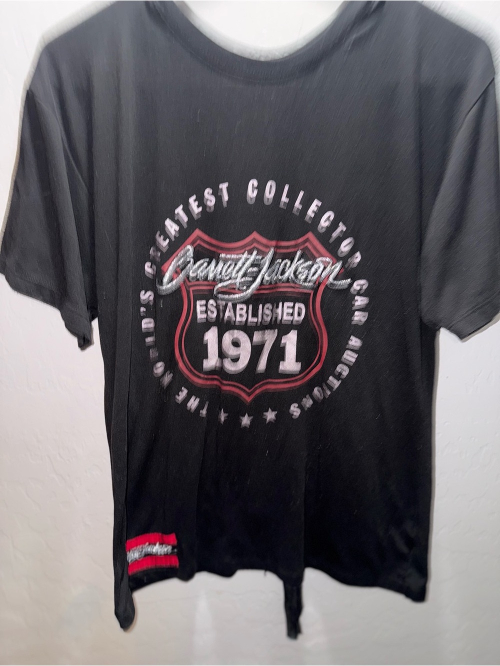 JACKSON Black Tee with Red and White Shield Graphic